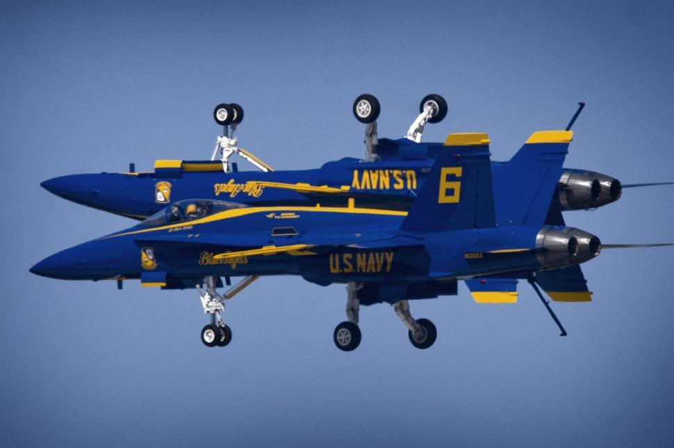 Free Image of Blue Fighter Jet Soaring Through Blue Sky 