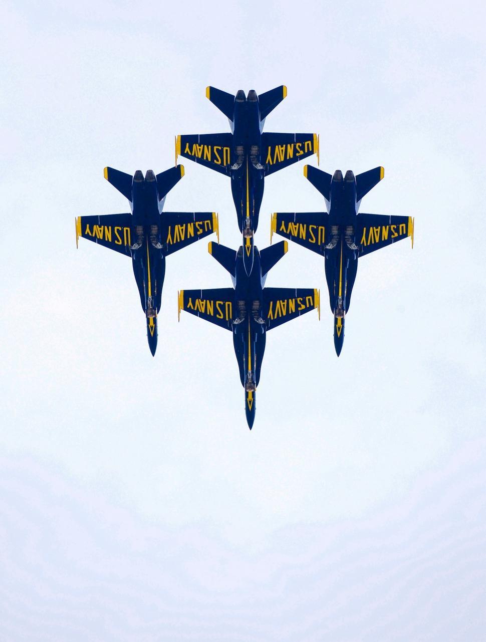 Free Image of Group of Fighter Jets Flying Through Blue Sky 