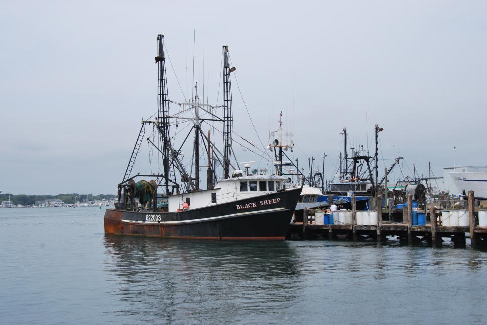 Free Image of Large Boat Docked at Pier in Water 
