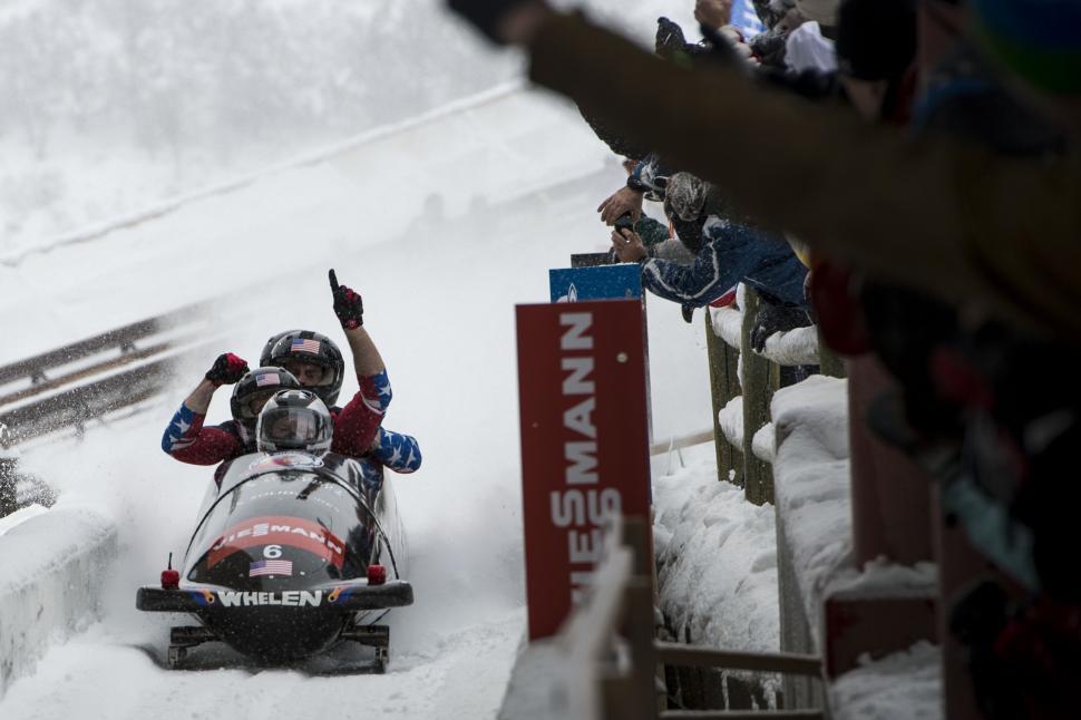 Free Image of Person Riding Snowmobile Down Snow Covered Slope 