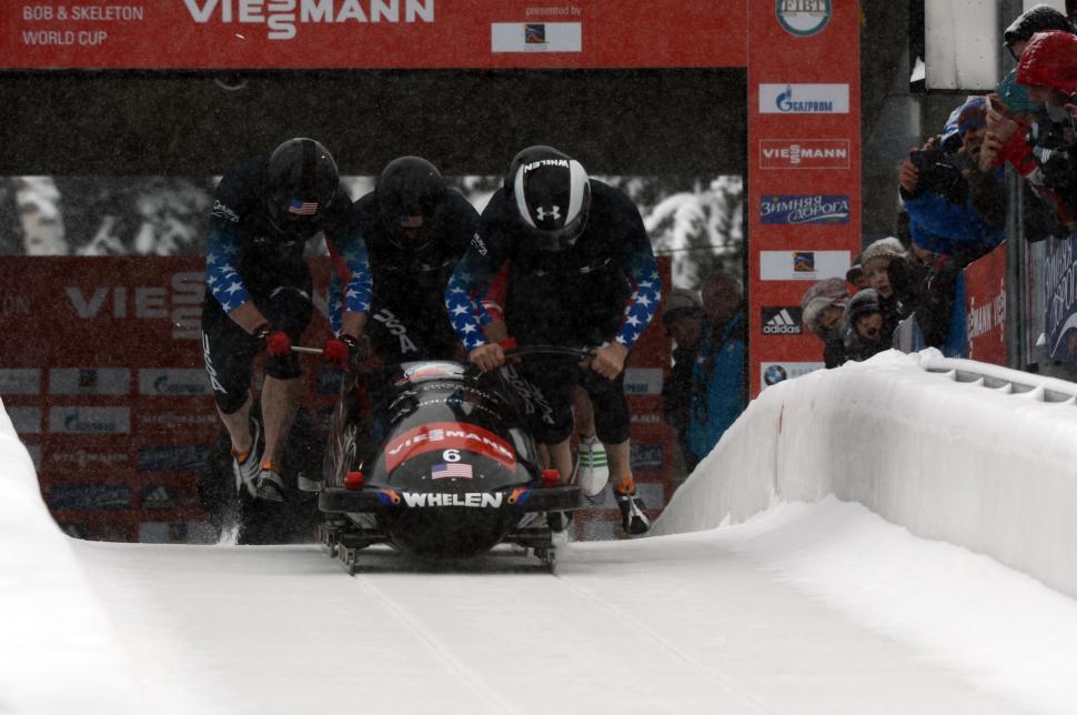 Free Image of Group of People Riding Down Snow Covered Slope 
