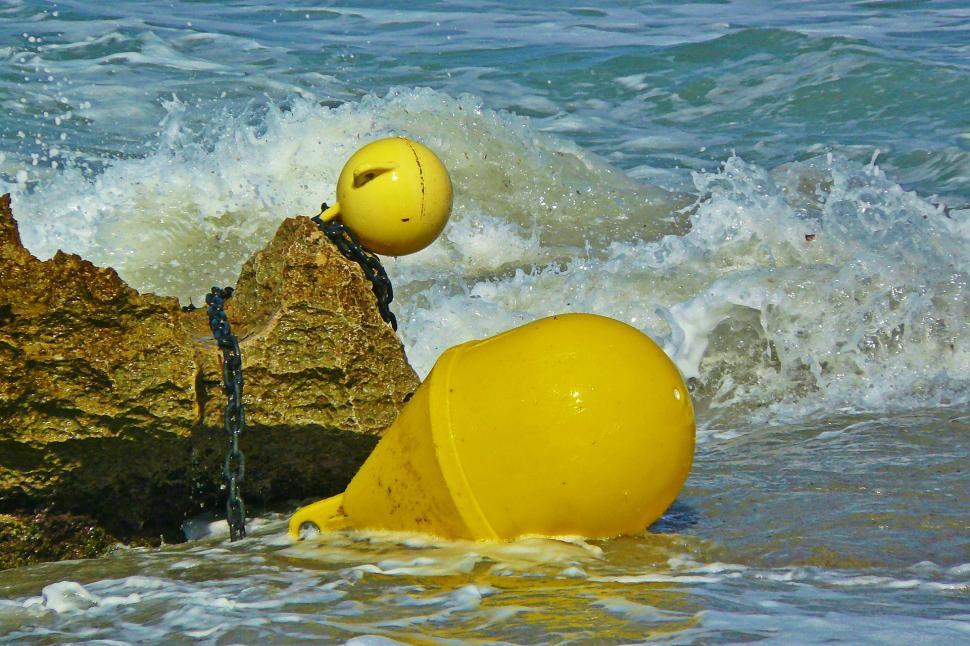 Free Image of Yellow Buoy Floating on Body of Water 