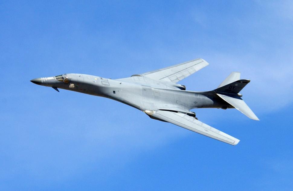 Free Image of Large Jetliner Flying Through Blue Sky 