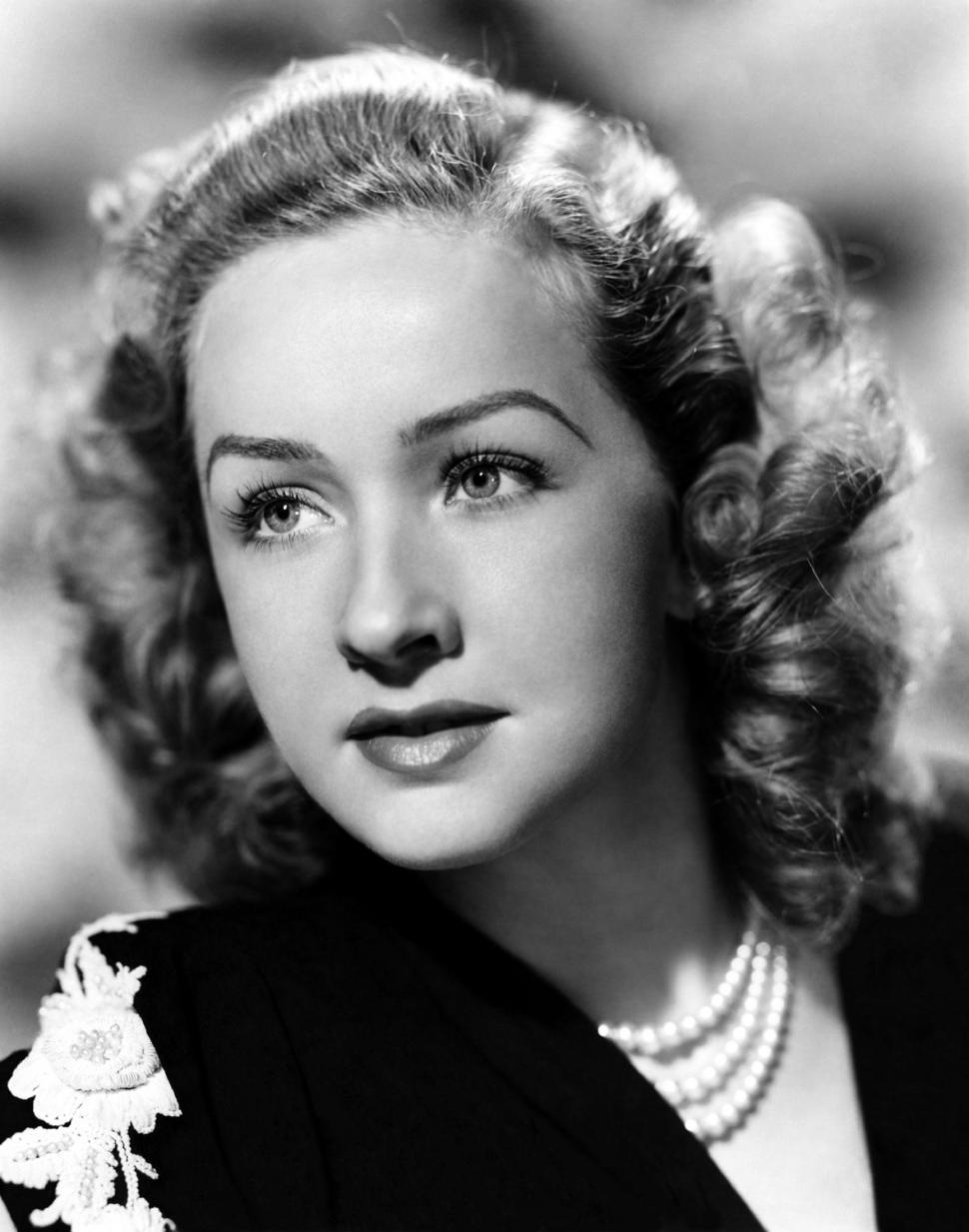 Free Image of Woman Wearing Pearls in Black and White 