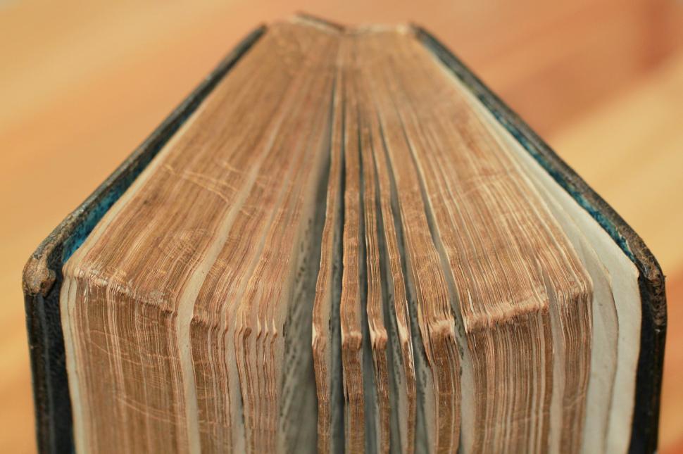 Free Image of Open Book on Wooden Table 