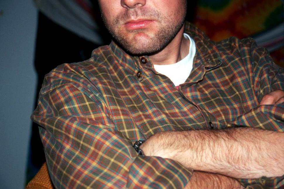 Free Image of Man With Crossed Arms in Plaid Shirt 