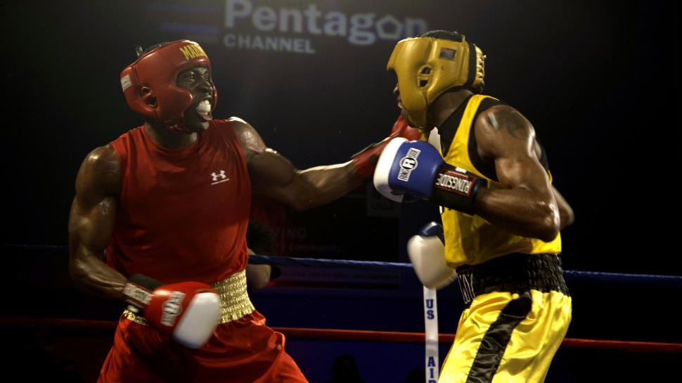 Free Image of Two Men Standing in Boxing Ring 