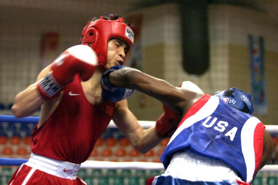 Free Image of Two Men Engaged in Boxing Match 