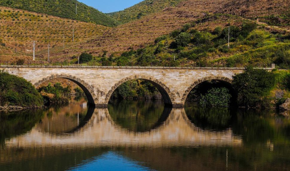 Free Image of Stone Bridge Crossing Waterway 
