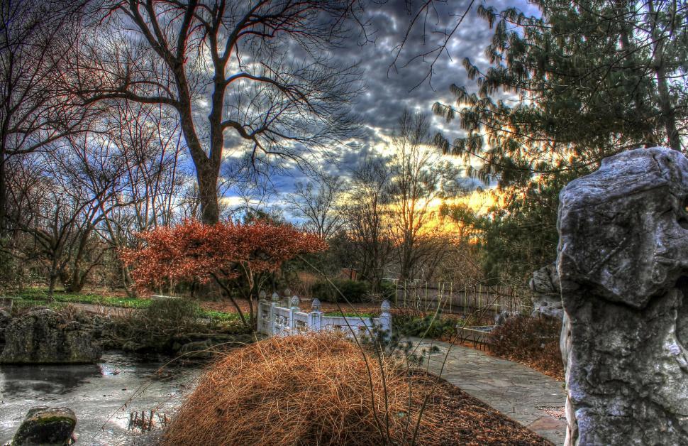 Free Image of Stone Statue Sitting Next to River 
