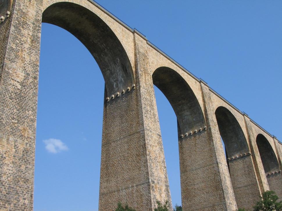 Free Image of Grand Stone Bridge With Clock Tower 