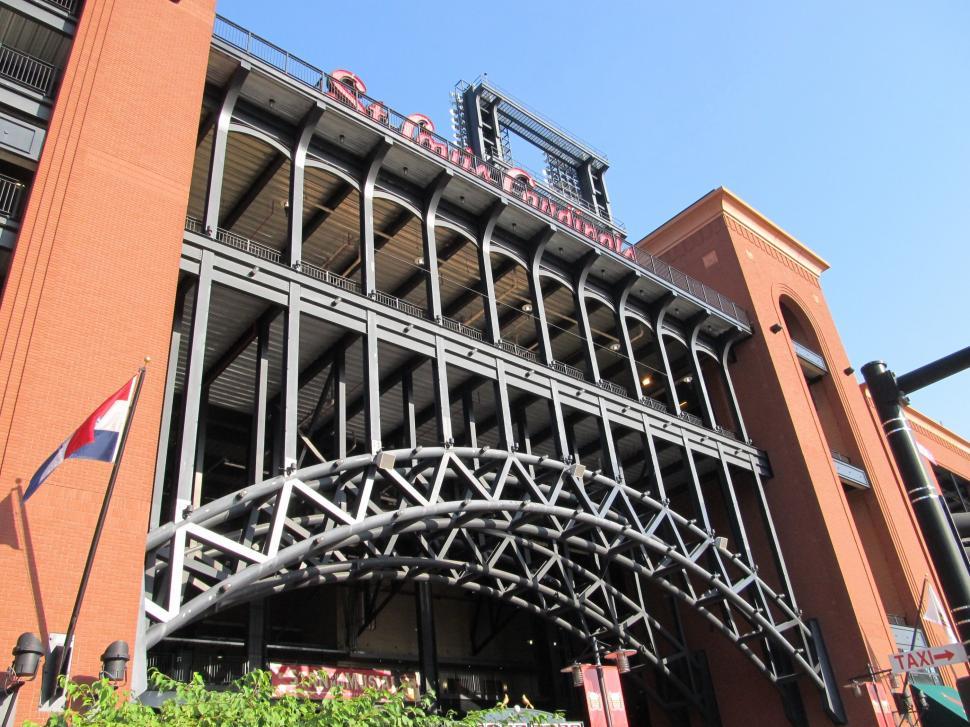 Free Image of Tall Building With Large Metal Structure on Top 