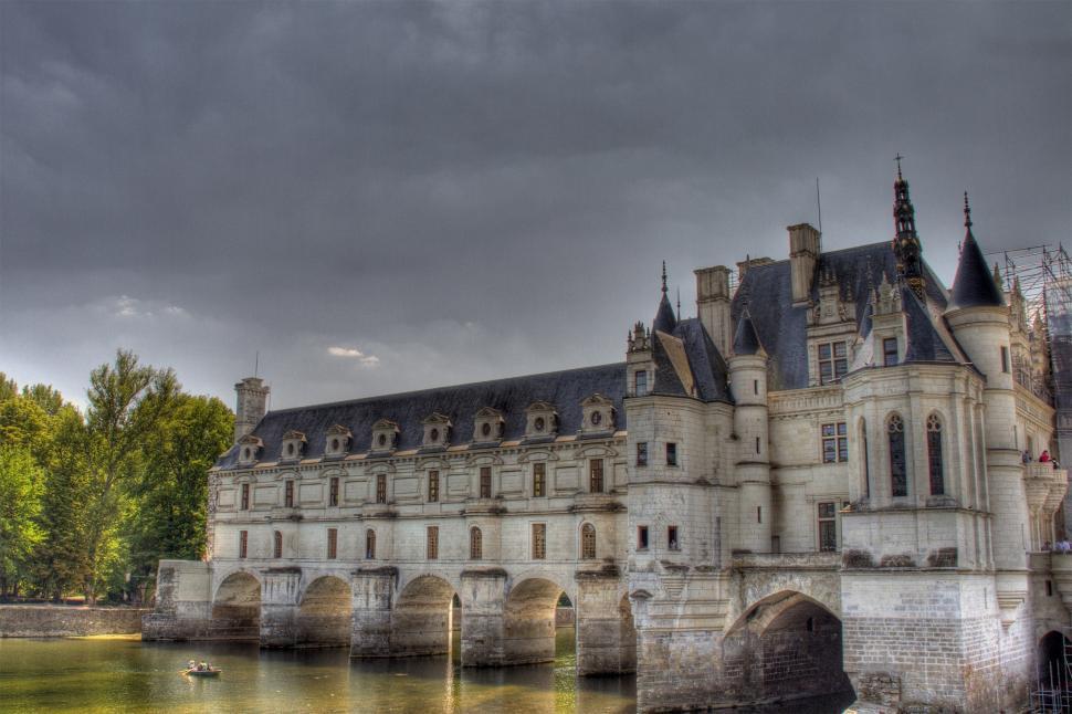 Free Image of Castle With Bridge Over Body of Water 