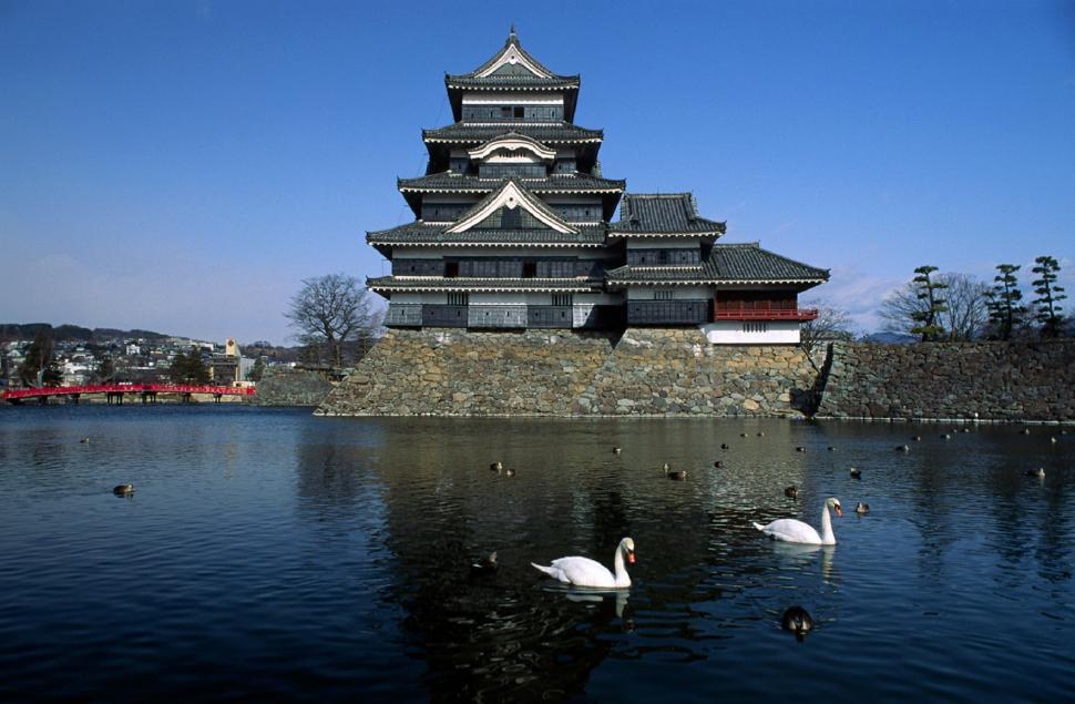 Free Image of Large Building Next to Water 