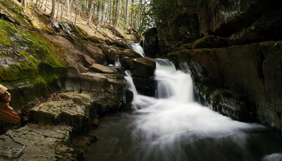 Free Image of Narrow Van Campens Glen Waterfall in shadow 