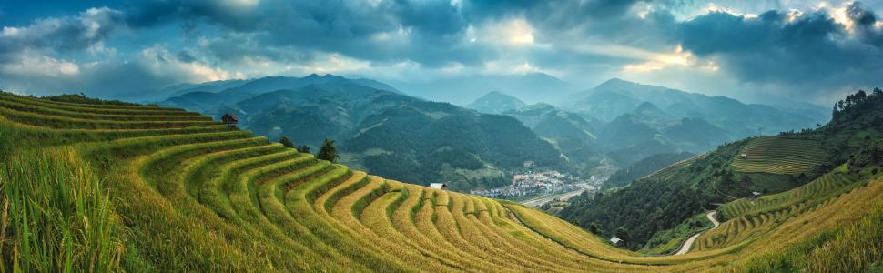 Free Image of Majestic Mountains Over Green Grass Field 