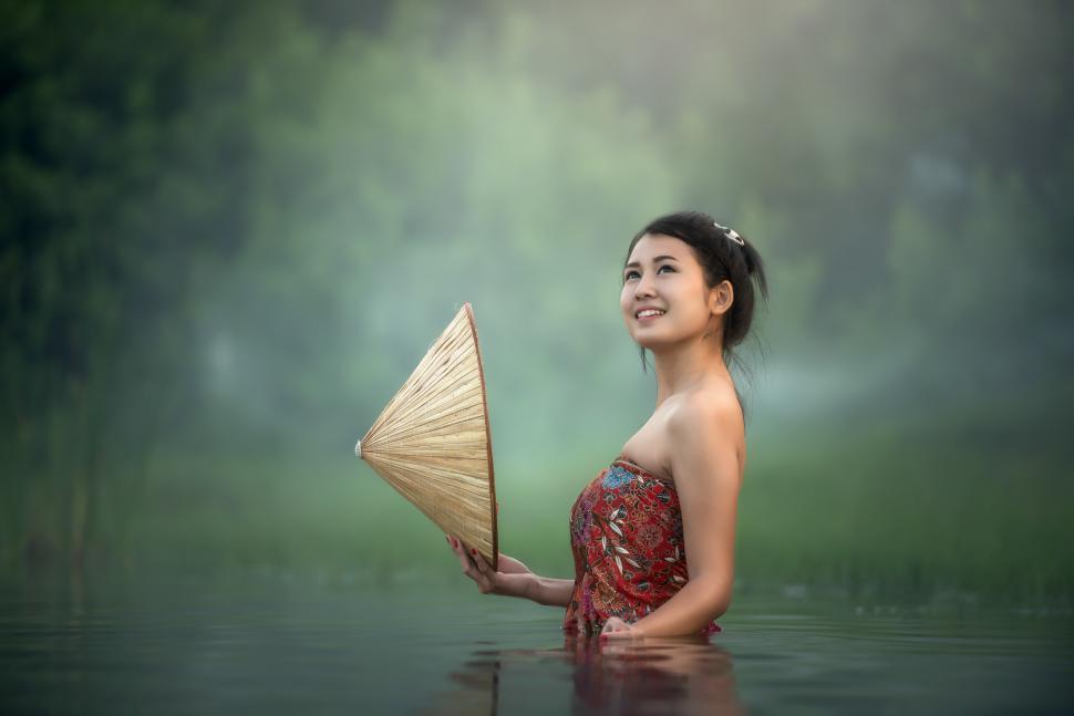 Free Image of Woman in Red Dress Holding Umbrella 
