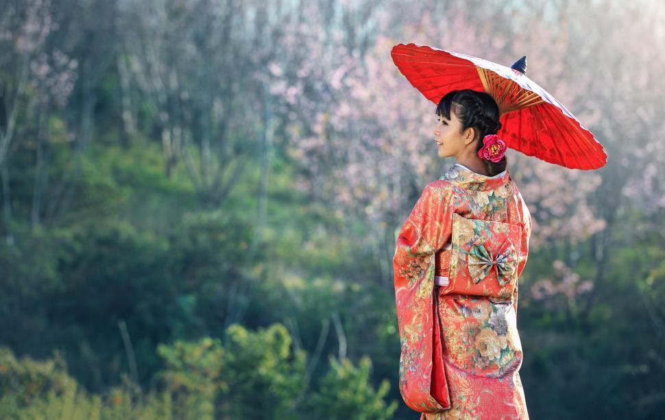 Free Image of Woman With Red Umbrella Standing in Field 