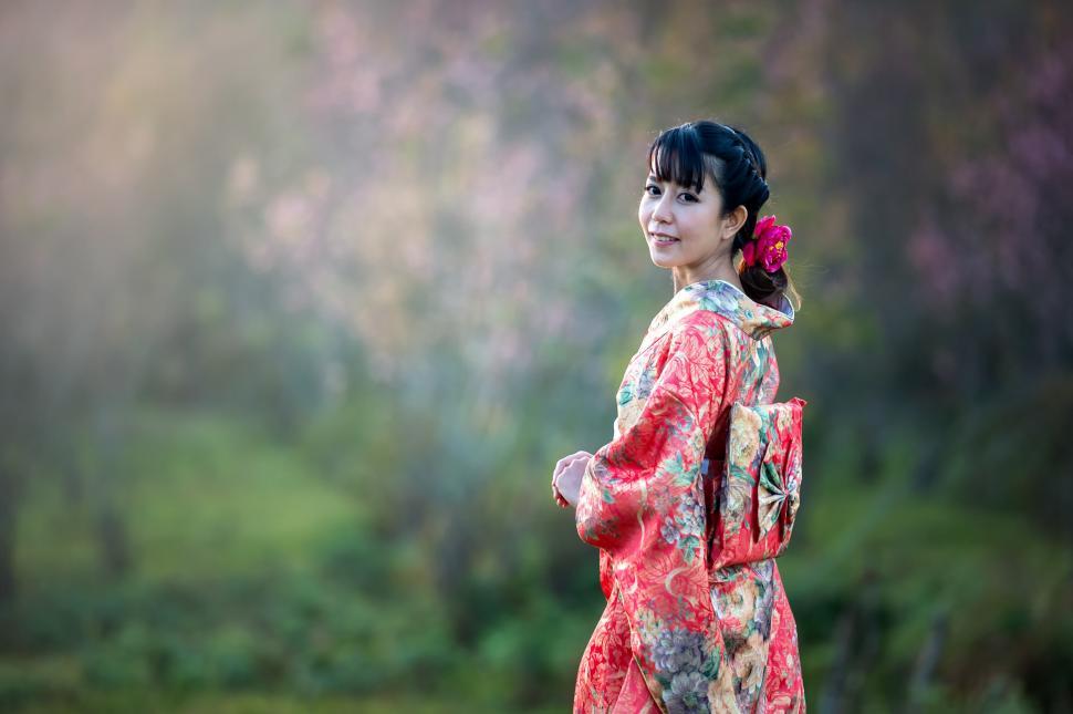 Free Image of Woman in Red Dress Standing in Field 