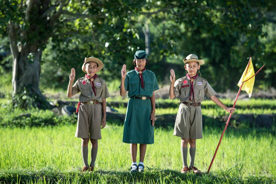 Free Image of Group of People Standing in Field 