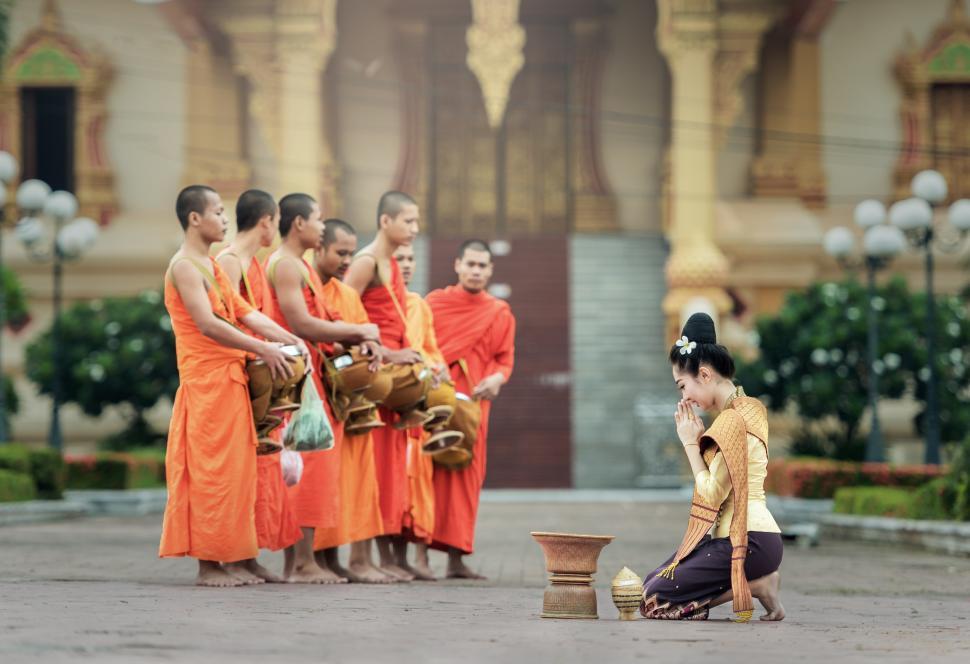 Free Image of Group of Men in Orange Robes Standing Together 