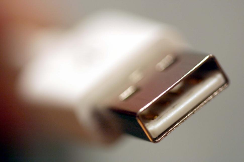 Free Image of Person Holding Cell Phone Closely 