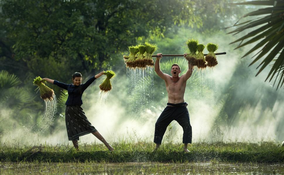 Free Image of Three Men Dancing in Grass 