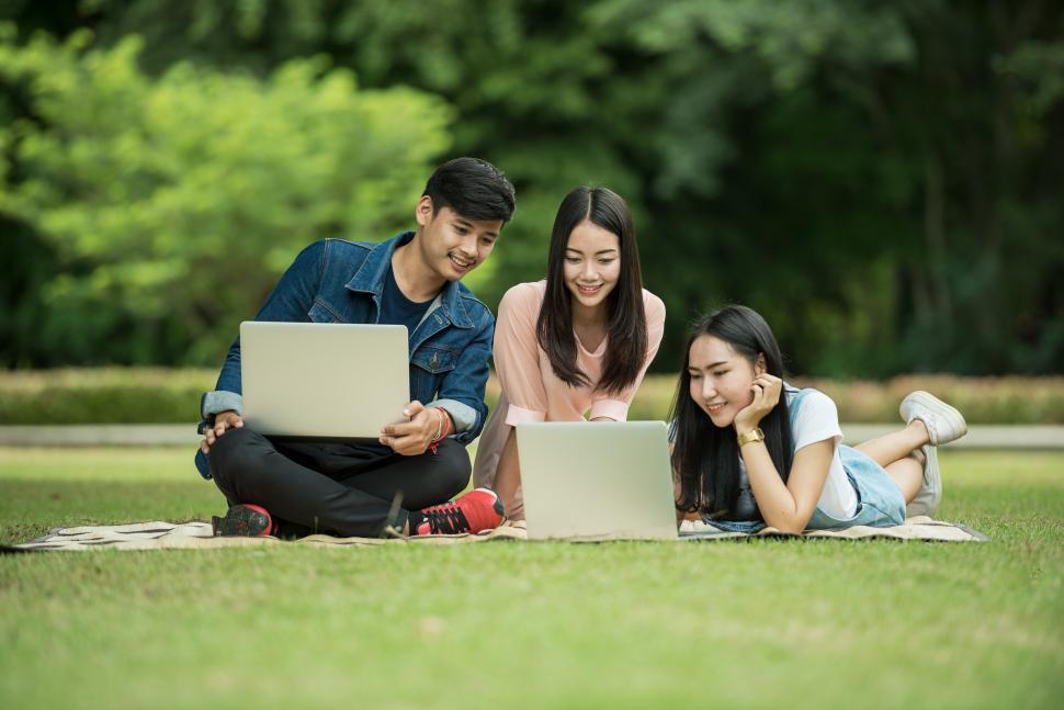 Free Image of People Laying in the Grass 