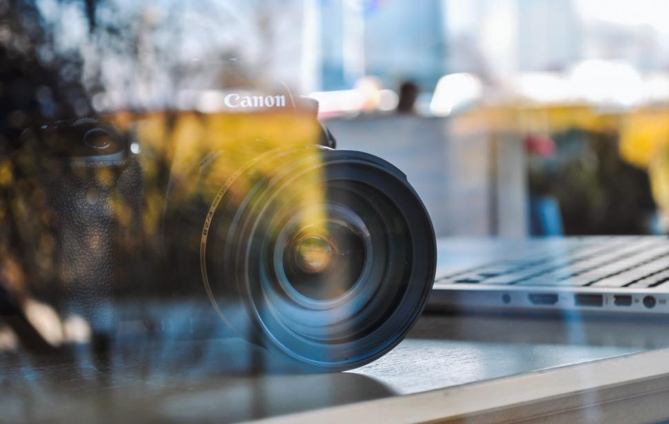 Free Image of Camera on Top of Laptop Computer 