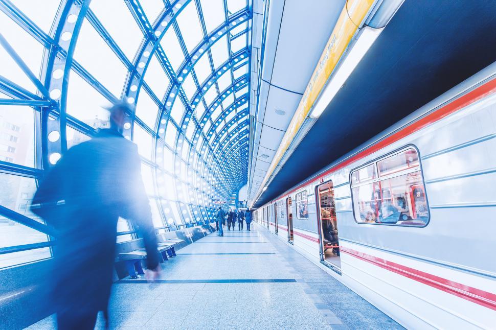 Free Image of Group of People Standing Next to Train at Train Station 