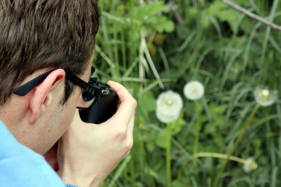 Free Image of Man in Blue Shirt Talking on Cell Phone 