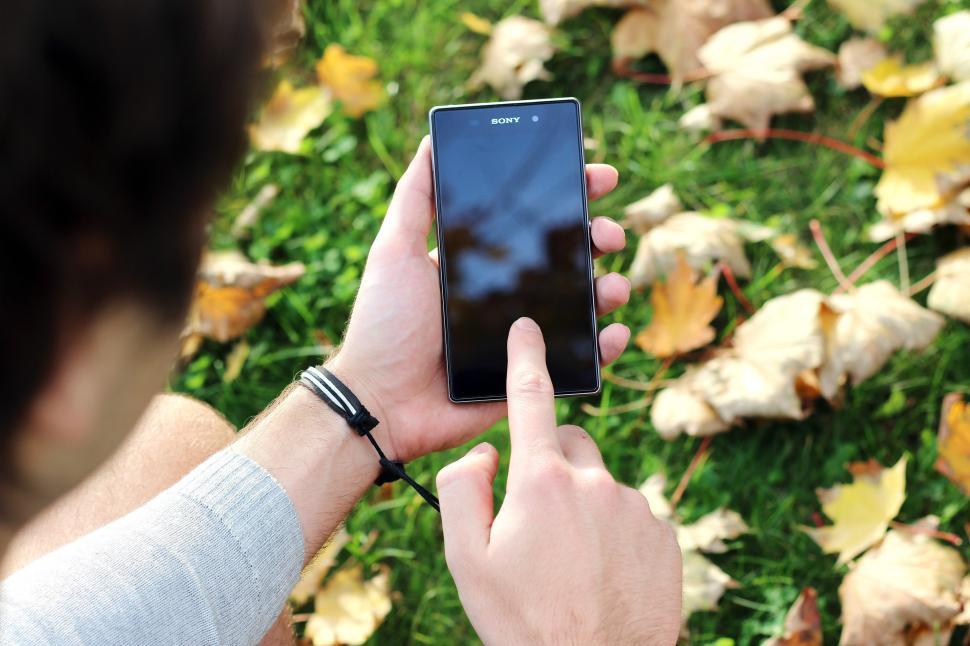 Free Image of Person Holding Cell Phone in Hand 