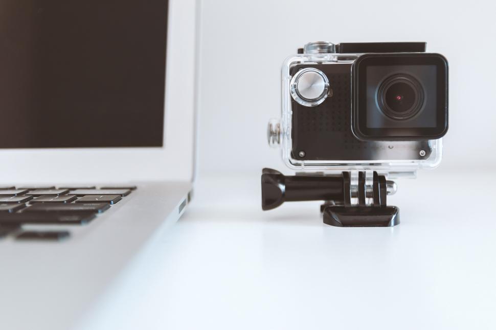 Free Image of Camera on Top of Laptop Computer 