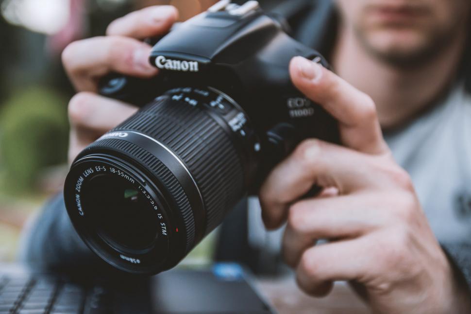 Free Image of Man Taking a Picture With a Camera 