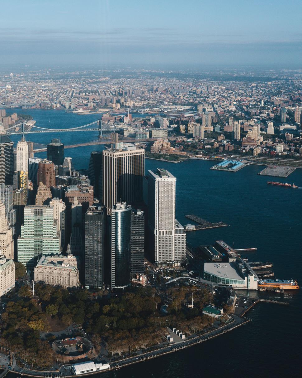 Free Image of Aerial View of Large City Alongside Body of Water 