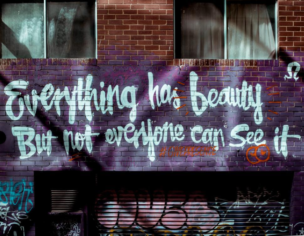 Free Image of Brick Building Defaced With Graffiti 