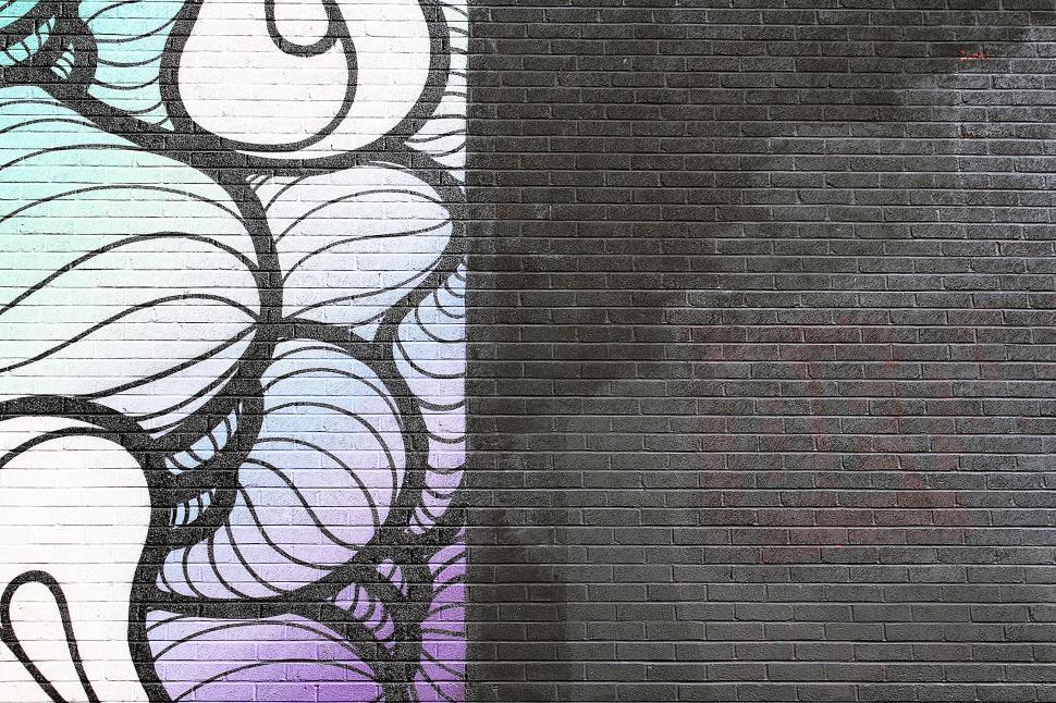 Free Image of A Black and White Photo of a Brick Wall 
