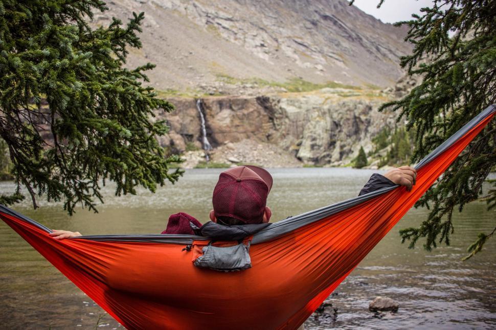 Free Image of Person Relaxing in Hammock in Water 
