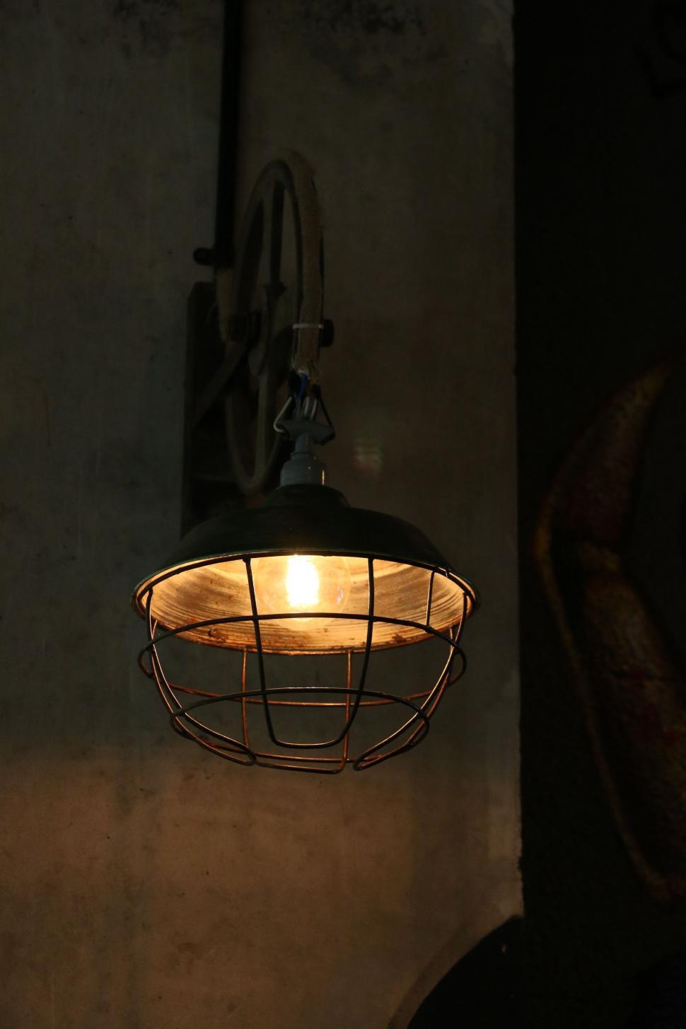 Free Image of Hanging Light Fixture on Side of Wall 