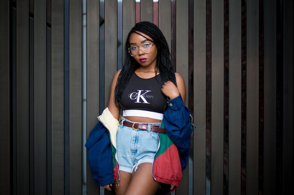 Free Image of Woman in Black Shirt and Blue Shorts 