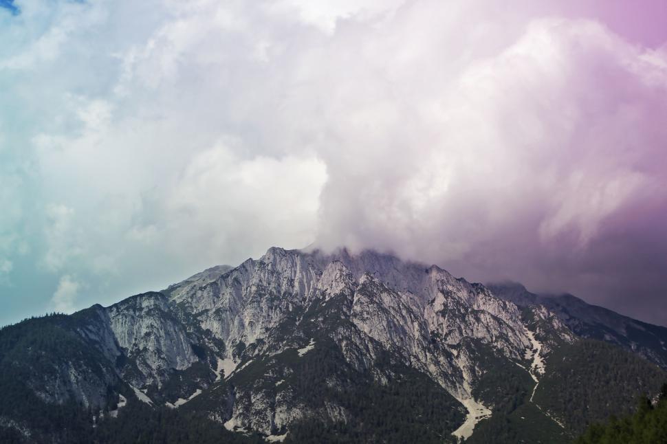 Free Image of Person Flying Kite in Sky Over Mountain 