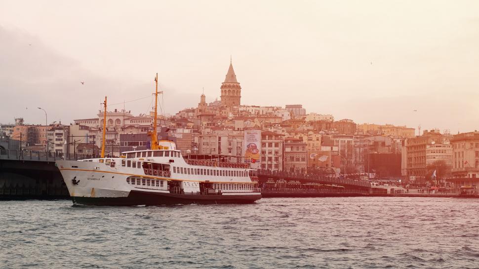 Free Image of Large Boat Floating Near City 