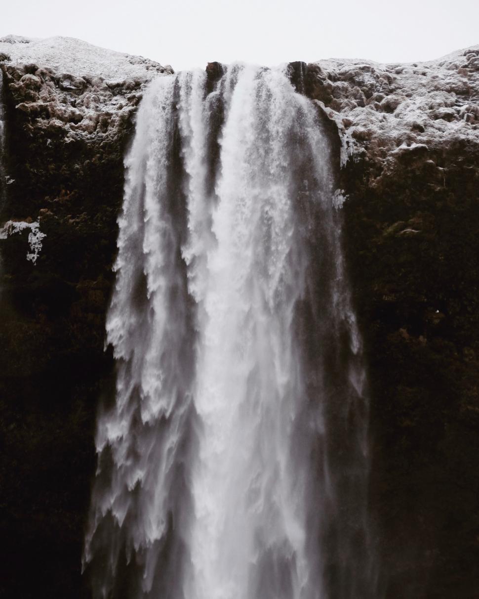 Free Image of Majestic Waterfall Cascading Down in Black and White 