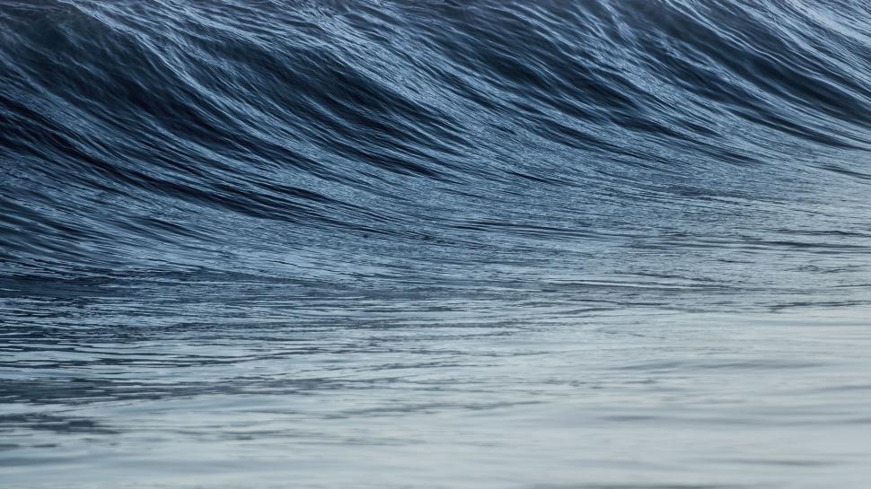Free Image of Man Riding Wave on Surfboard 