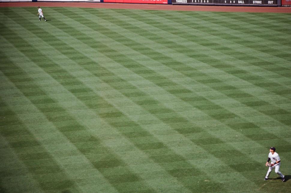 Free Image of Baseball Player Running Across Baseball Field 