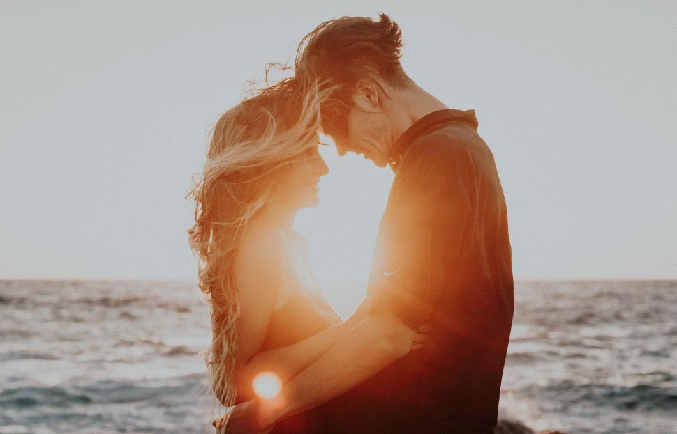 Free Image of Man and Woman Standing Near Ocean 