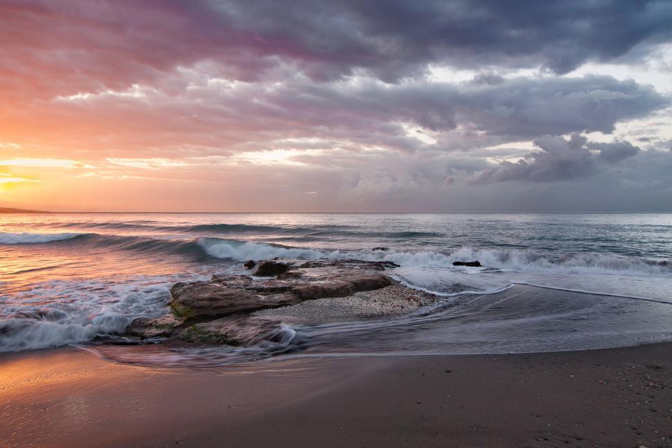 Free Image of Beach With Waves Rushing Ashore 