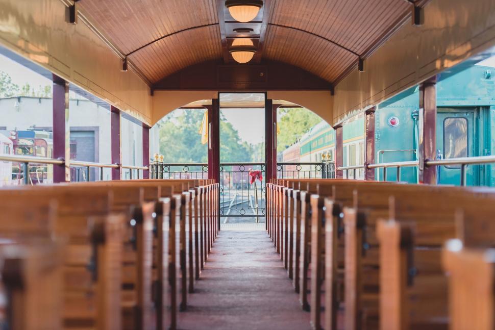 Free Image of Train Station With Rows of Wooden Benches 