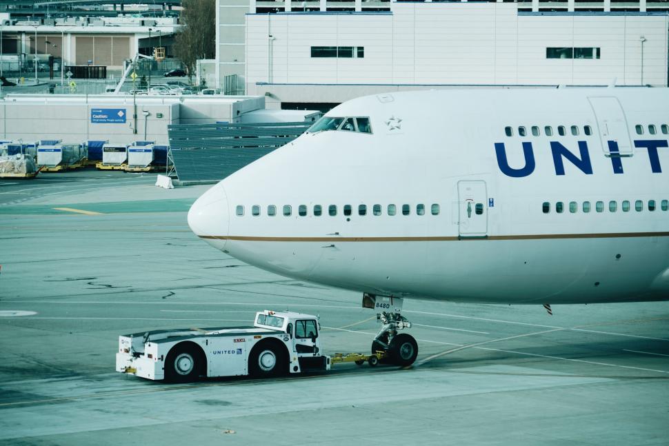 Free Image of Large Jetliner Parked on Airport Tarmac 