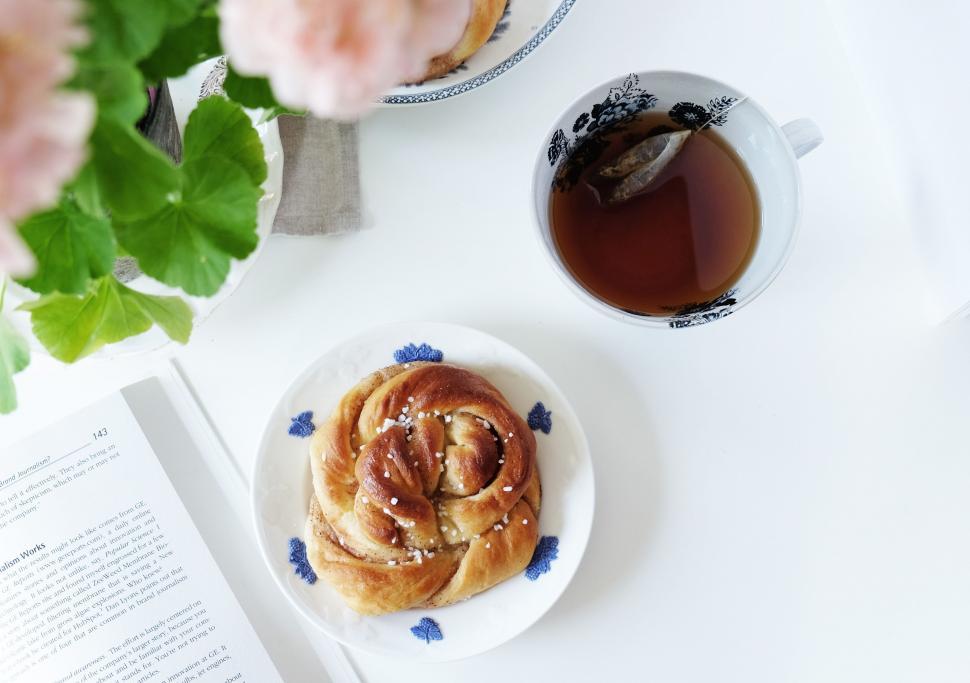 Free Image of A Cup of Tea and Plate of Food on a Table 